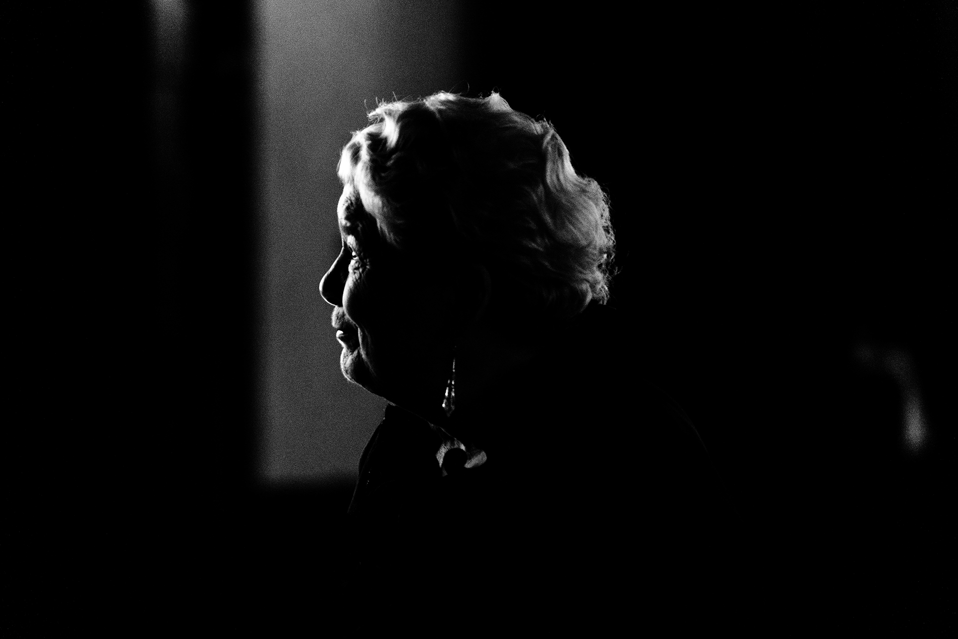 Woman standing next to a stage